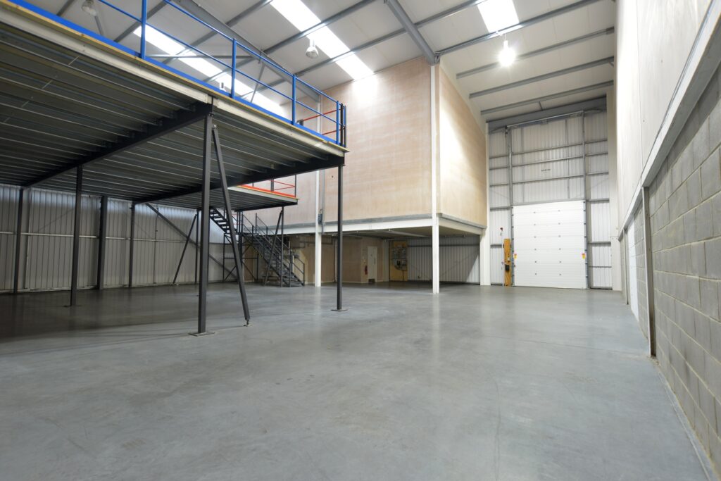 Warehouse with mezzanine floor for increased storage capacity