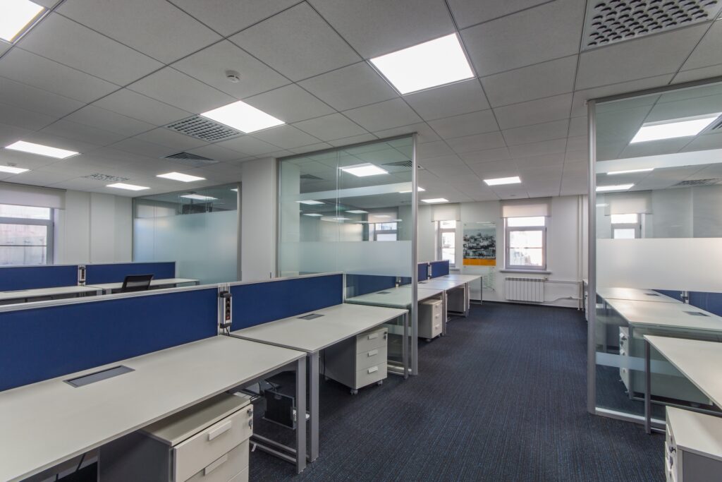 Affordable glass partition dividing office space for privacy while maintaining an open, bright feel