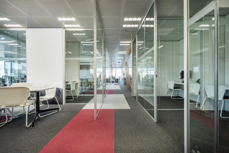 Modern office with custom glass partitions for meeting rooms