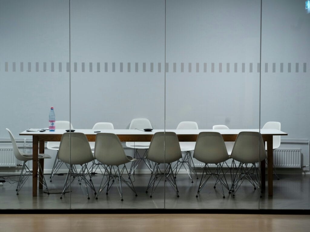 Glazed glass partitions allowing natural light in modern office